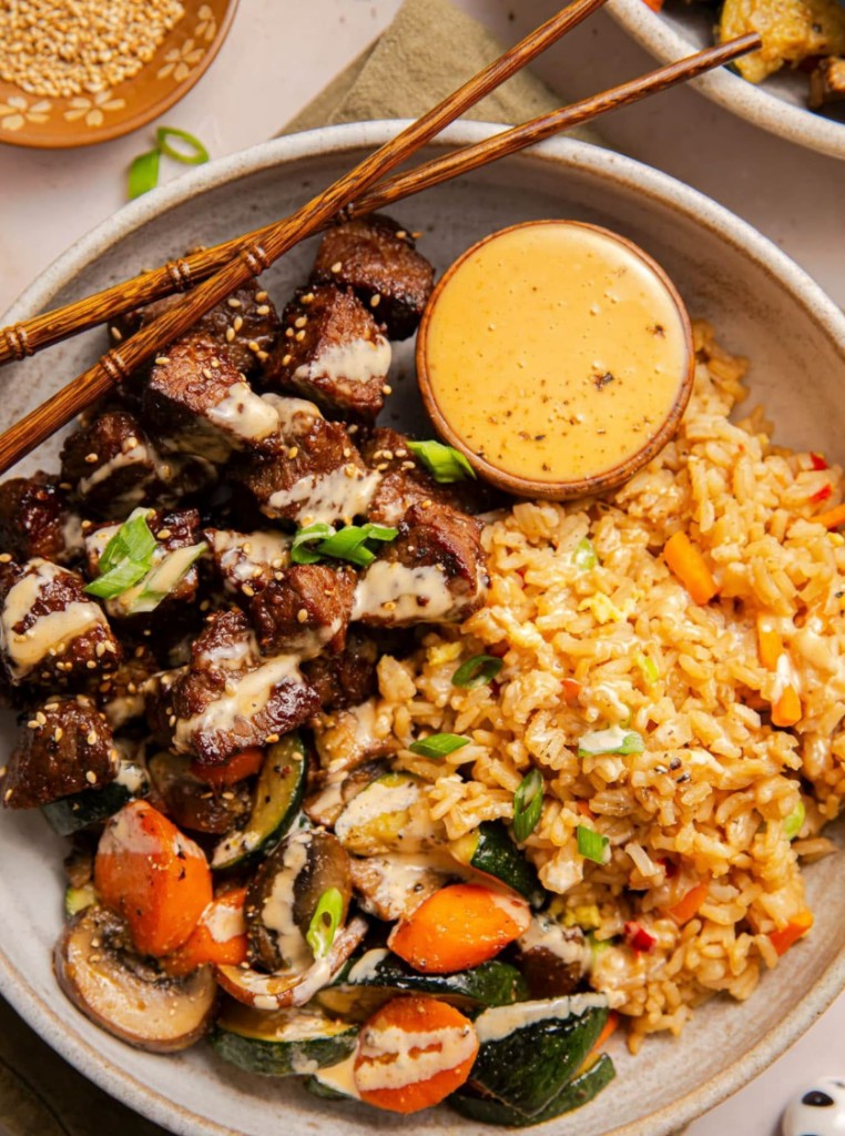 Steak hibachi bowl with fried rice and vegetables