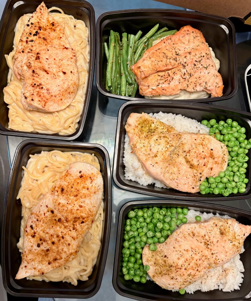 Creamy chicken pasta, salmon, and chicken rice meals